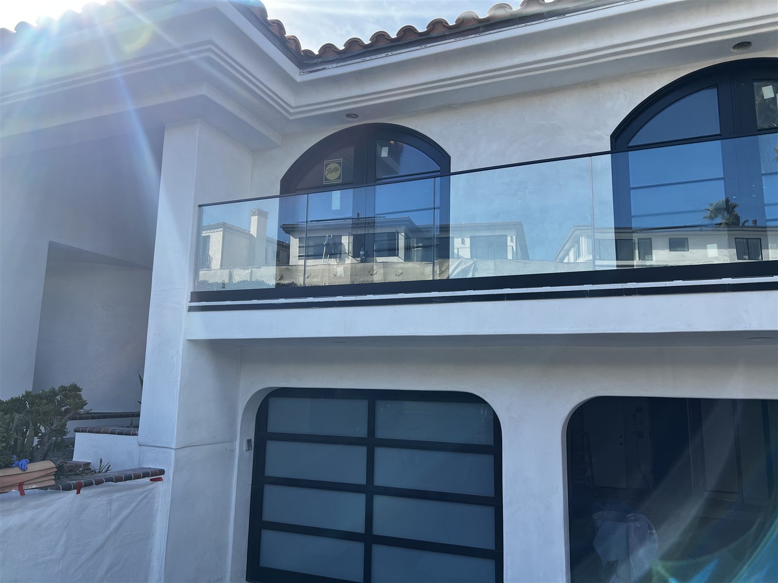 Staircase glass railing with stainless hardware